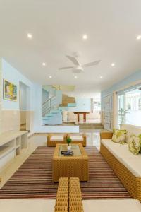 a living room with a couch and a coffee table at Mansão Santa Tereza delux in Rio de Janeiro
