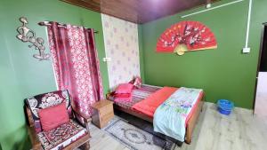 Postel nebo postele na pokoji v ubytování Seven Hills Homestay