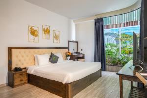 Voodi või voodid majutusasutuse Greenview City Hotel toas