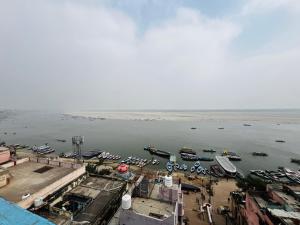 an aerial view of a harbor with boats in the water at KS PAYING GUEST HOUSE in Varanasi