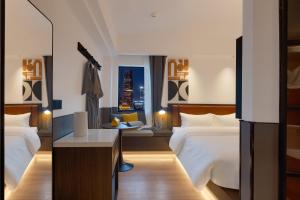 Mcsrh Hotel-Changsha IFS and WUYI Plaza客房内的一张或多张床位