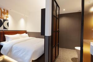 Mcsrh Hotel-Changsha IFS and WUYI Plaza客房内的一张或多张床位