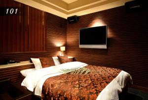 Ένα ή περισσότερα κρεβάτια σε δωμάτιο στο Hotel Ayung 大人専用
