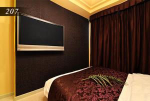 Ένα ή περισσότερα κρεβάτια σε δωμάτιο στο Hotel Ayung 大人専用