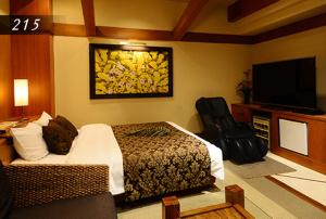 Μια τηλεόραση ή/και κέντρο ψυχαγωγίας στο Hotel Ayung 大人専用