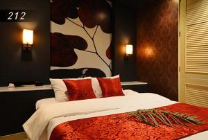 Ένα ή περισσότερα κρεβάτια σε δωμάτιο στο Hotel Ayung 大人専用