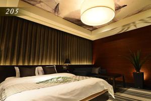 Ένα ή περισσότερα κρεβάτια σε δωμάτιο στο Hotel Ayung 大人専用