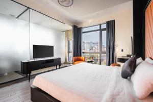Voodi või voodid majutusasutuse Greenview City Hotel toas