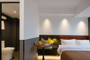 Mcsrh Hotel-Changsha IFS and WUYI Plaza客房内的一张或多张床位