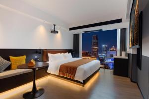 Mcsrh Hotel-Changsha IFS and WUYI Plaza客房内的一张或多张床位