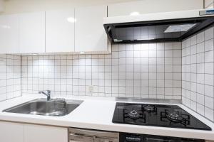 Kuchyň nebo kuchyňský kout v ubytování MSBuilding II