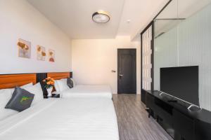 Voodi või voodid majutusasutuse Greenview City Hotel toas