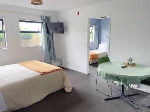 Postel nebo postele na pokoji v ubytování AAA Northlands Motel