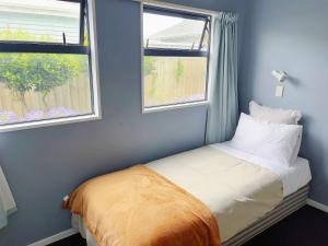 Postel nebo postele na pokoji v ubytování AAA Northlands Motel