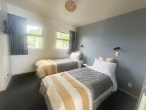 Postel nebo postele na pokoji v ubytování AAA Northlands Motel