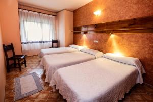 Postel nebo postele na pokoji v ubytování Hostal ROMI