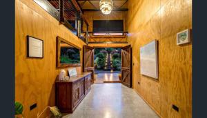a hallway of a house with wooden walls at Luxury on Lake Tinaroo Lakefront Living in Yungaburra