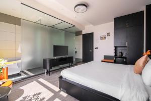 Voodi või voodid majutusasutuse Greenview City Hotel toas