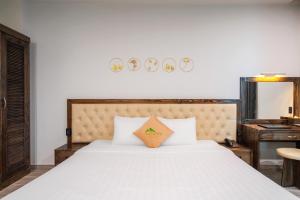 Voodi või voodid majutusasutuse Greenview City Hotel toas