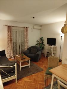 TV a/nebo společenská místnost v ubytování Gold Apartments + 91 fotografií