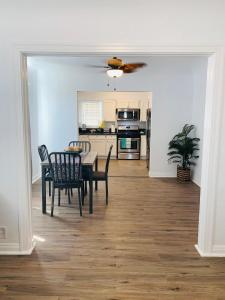 a dining room and kitchen with a table and chairs at Cozy Home Away From Home in Mojave
