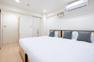 Postel nebo postele na pokoji v ubytování MSBuilding II