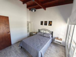 En eller flere senge i et værelse på Departamento Bellamar II