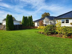 a house with a yard with green grass at Johannas' have in Faaborg