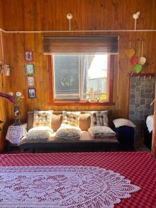 Ένα ή περισσότερα κρεβάτια σε δωμάτιο στο Cabaña Familiar en Pucatrihue