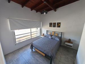 En eller flere senge i et værelse på Departamento Bellamar I