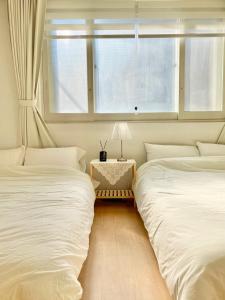 Postel nebo postele na pokoji v ubytování Slow Stay, #SK Hynix#5 minutes to Chungnam National University#10 minutes to Terminal#Hotel Bedding