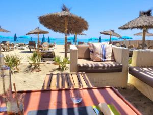 a patio with a table and chairs on the beach at Canet - Appartement T3 Neuf, Climatisé, 4 Pers, Parking inclus - FR-1-794-98 in Canet-en-Roussillon