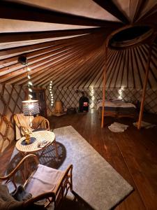 a room with a bed and a table in a yurt at Jurte in den Bergen in Bad Reichenhall