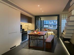 a kitchen with a table and a dining room at Lucky Jili in Chengdu