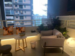 a living room with a couch and a table at Lucky Jili in Chengdu