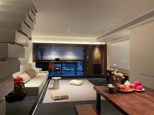 a living room with a couch and a table at Lucky Jili in Chengdu