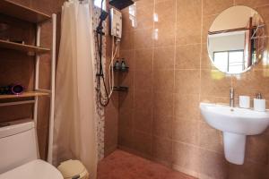 a bathroom with a sink and a toilet and a mirror at Casa Eden - Double King Bed - Peaceful Garden Retreat - 4K SmartTV in Koh Phangan +34 photos