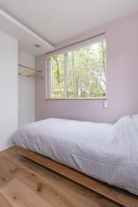 Postel nebo postele na pokoji v ubytování Rinrei terrace 一棟貸切 シングルルーム6部屋 各部屋トイレ シャワー付