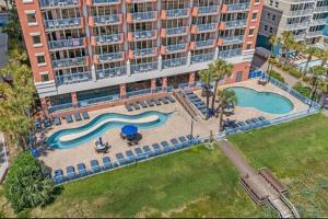 an aerial view of a swimming pool at a hotel at Oceanfront Ocean Pearl in Myrtle Beach in Myrtle Beach