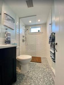 a bathroom with a toilet and a shower at North Truro Pet-friendly home near Secluded Beach in Provincetown