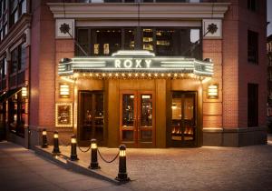 a building with a row of lights in front of it at Roxy Hotel New York in New York