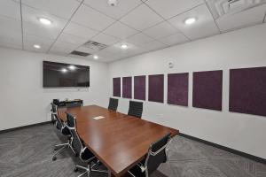 a conference room with a long wooden table and chairs at Convention Ctr - Stylish 2BD,2BA with Pool,Gym and Hot tub in Salt Lake City +37 photos