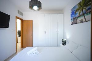 Ένα ή περισσότερα κρεβάτια σε δωμάτιο στο Shoham Sea and Soul