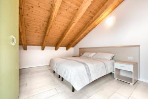 Postel nebo postele na pokoji v ubytování Jesolo Village Beach House - Host Solution