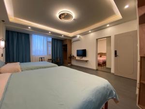 Fuxian Lake Qishe B&B客房内的一张或多张床位