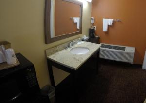 a bathroom with a sink and a mirror at Americas Best Value Inn Blythe CA in Blythe +9 photos
