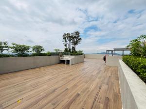 an outdoor deck with a bench on a house at Youth City Residence in Nilai