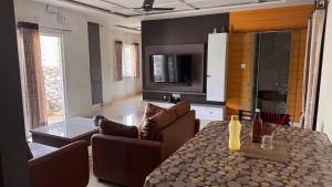 a living room with a couch and a table at Homestay in Kompally in Hyderabad