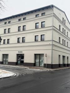 an office building on the corner of a street at Apartament Centro 9 in Leszno