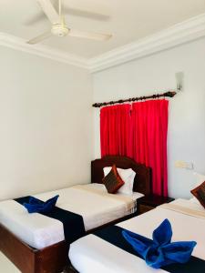 Postel nebo postele na pokoji v ubytování Golden Papaya Guesthouse